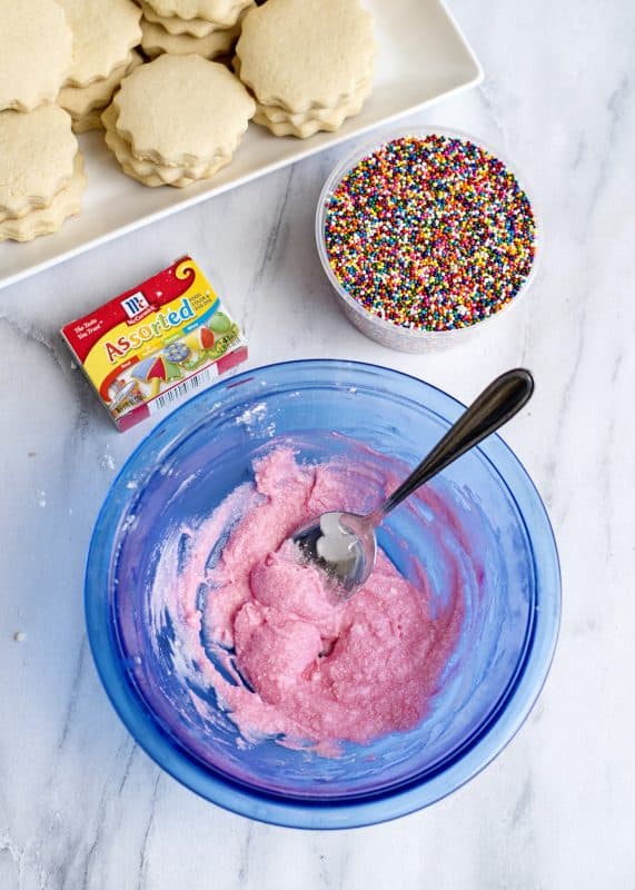 Add food coloring to tea cake icing.