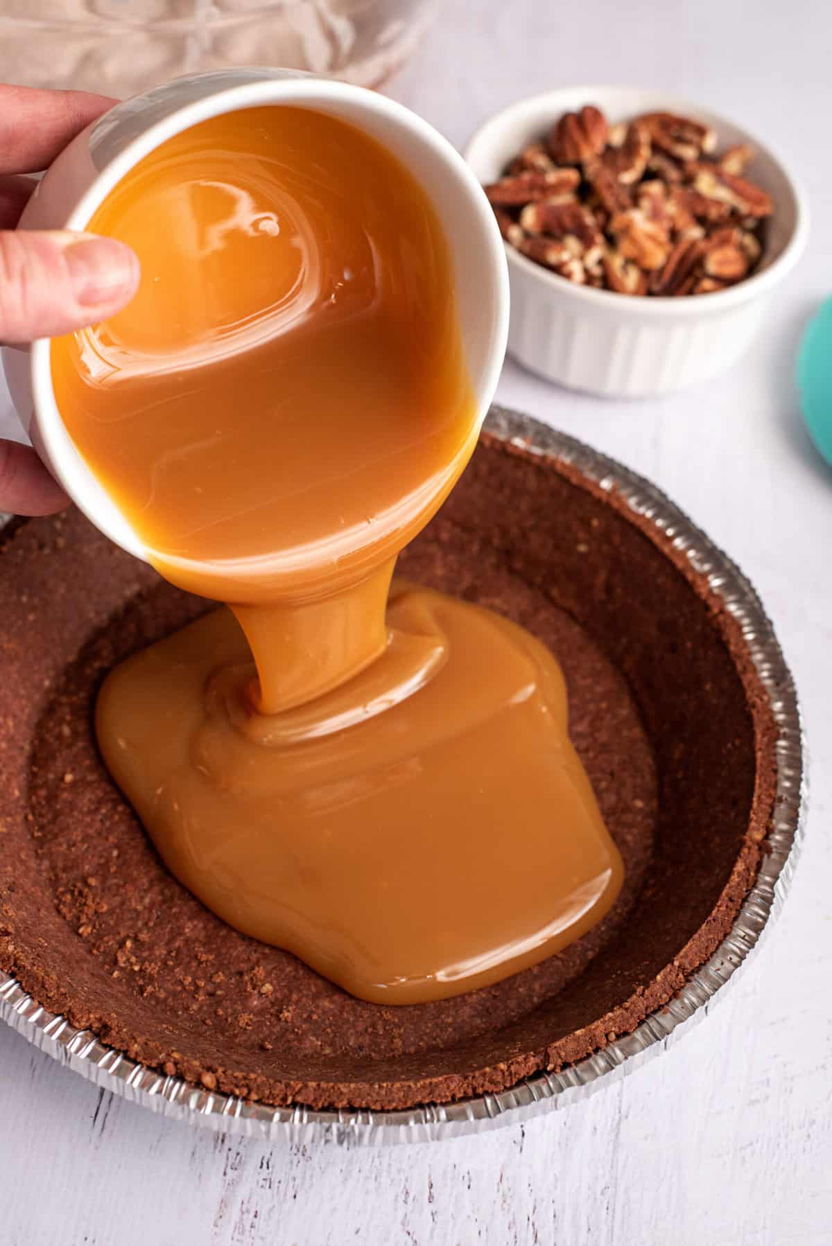 pour caramel into pie crust