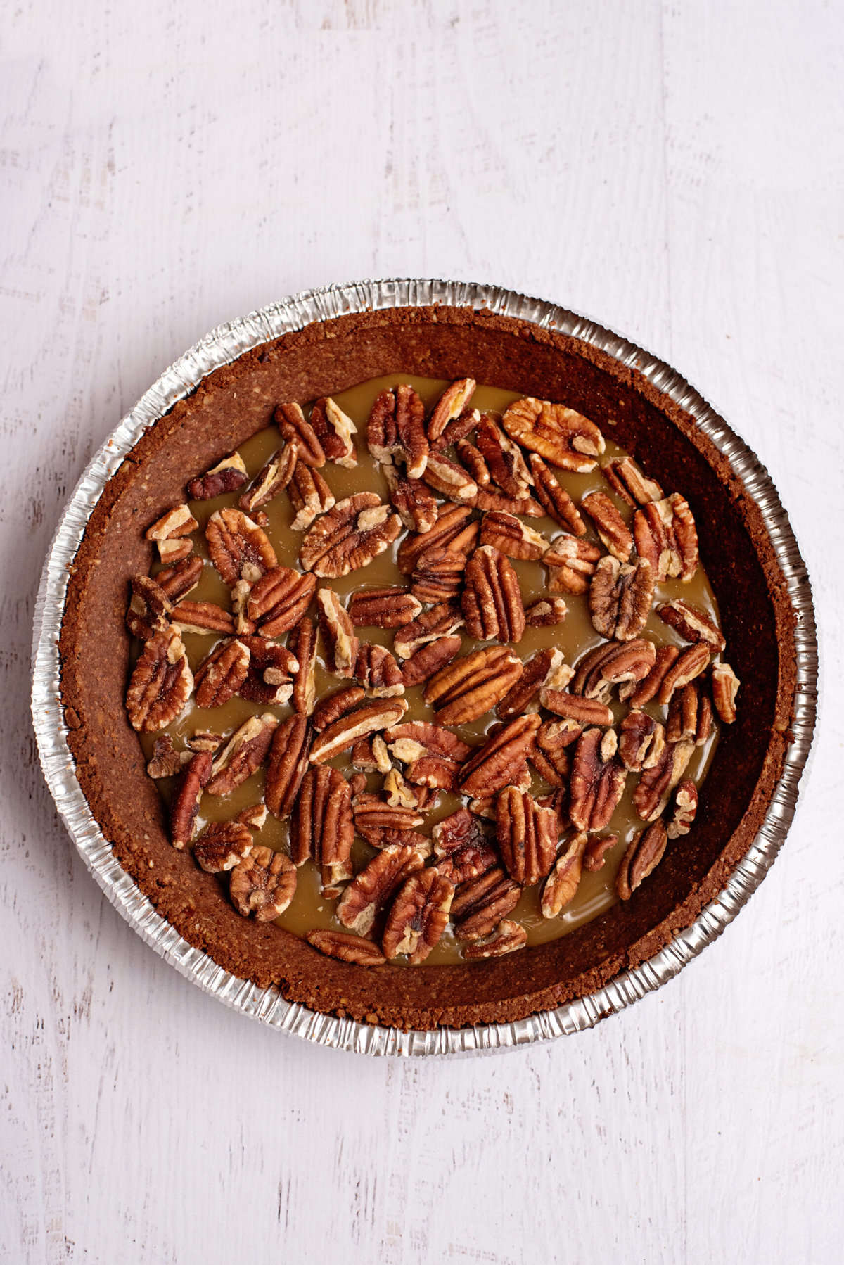 sprinkle pecans over the caramel in the frozen turtle pie