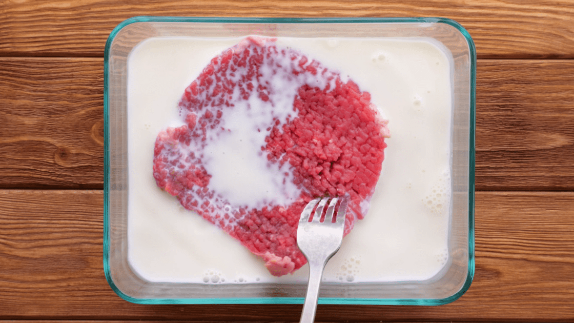 Dip cube steak in milk.