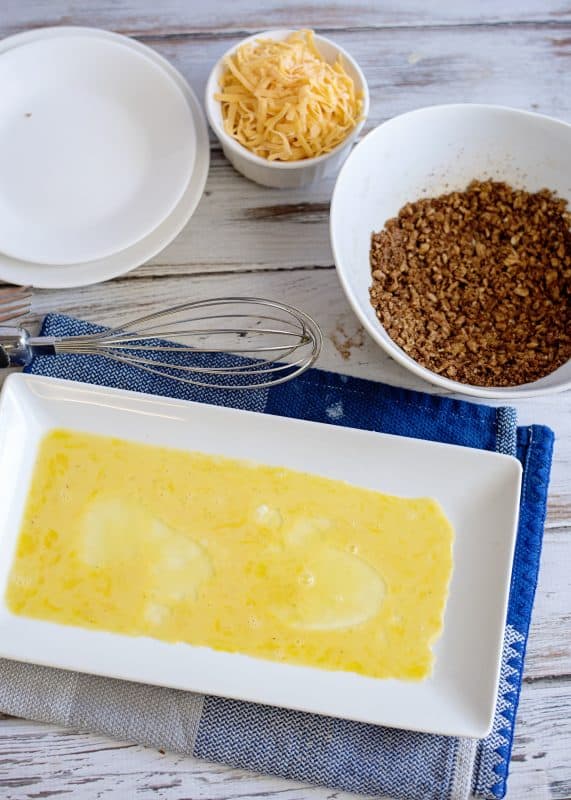 Add beaten eggs to separate shallow dish.