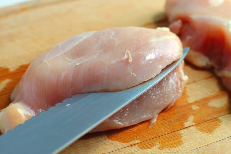 Carefully cut a pocket into each chicken breast.