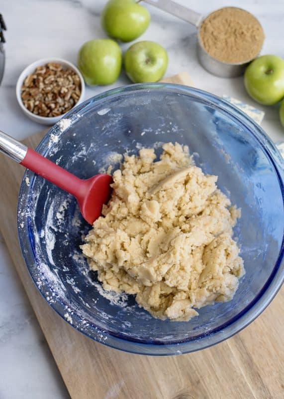 The cake batter will become a thick dough.