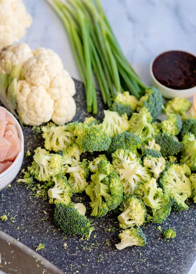 Chop broccoli and cauliflower into florets.