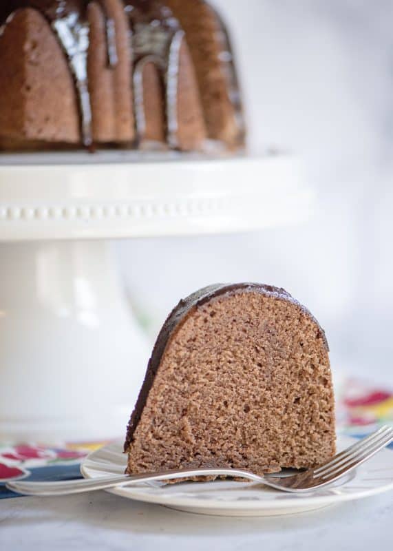 Slice of Chocolate Pound Cake with Fudge Glaze.