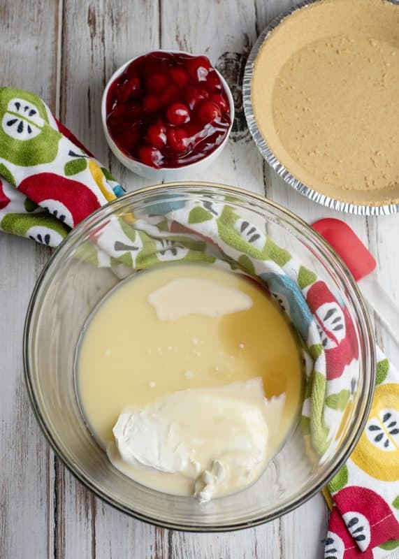 Add lemon juice and vanilla to mixing bowl.