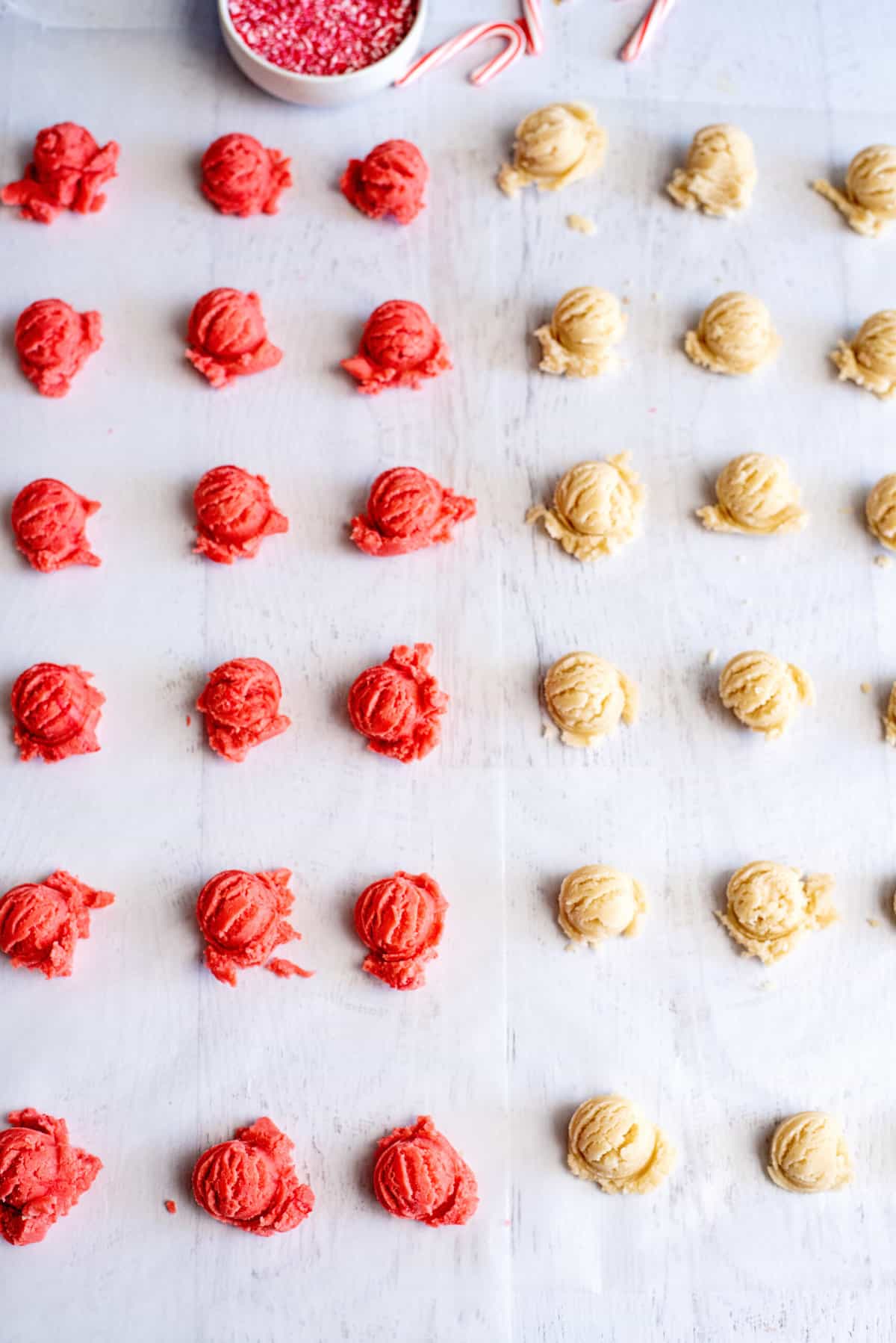 scoop candy cane cookie dough into one teaspoon portions