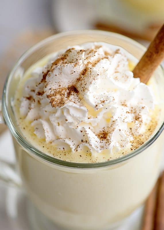 Top eggnog with whipped cream and cinnamon.