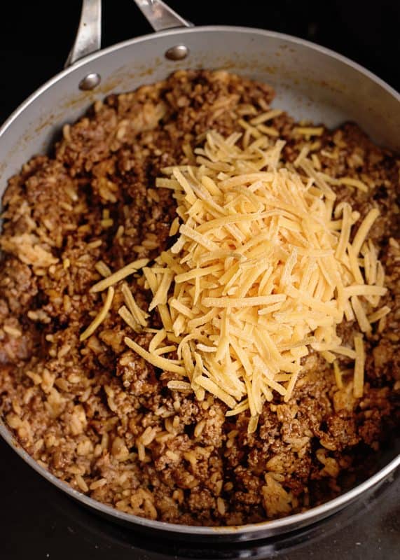 Making meat mixture for stuffed peppers with ground turkey.