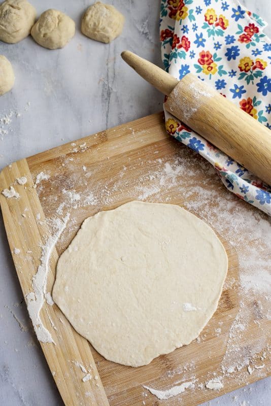 rolling out tortillas