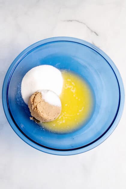 Add both sugars to butter in mixing bowl.