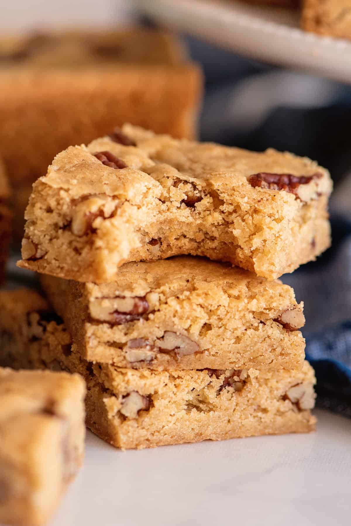 A bite taken out of a pecan chewy bar.