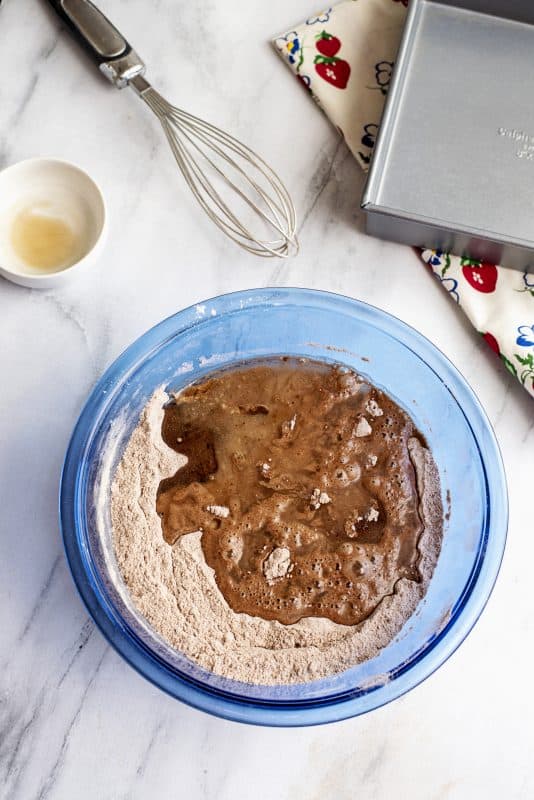 Add wet ingredients to dry in mixing bowl.