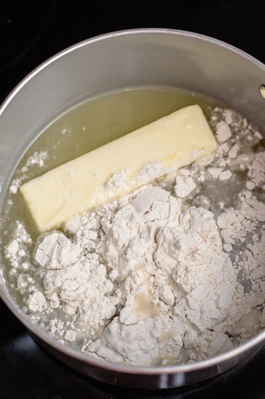 Place butter, flour, pineapple juice, and sugar in a saucepot and bring to a boil.