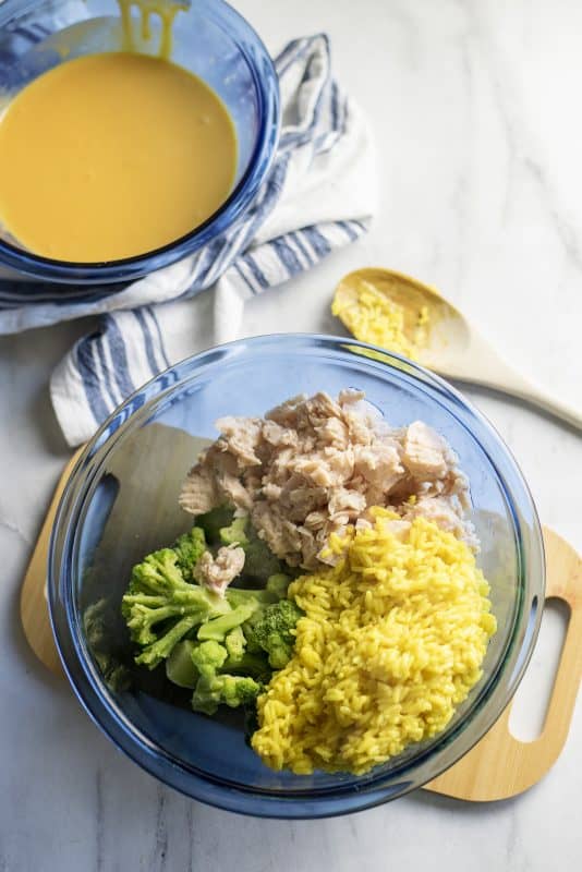 In different bowl, add broccoli, chicken, and rice.