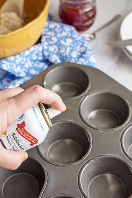 spray six cups in a muffin tin with cooking spray. 