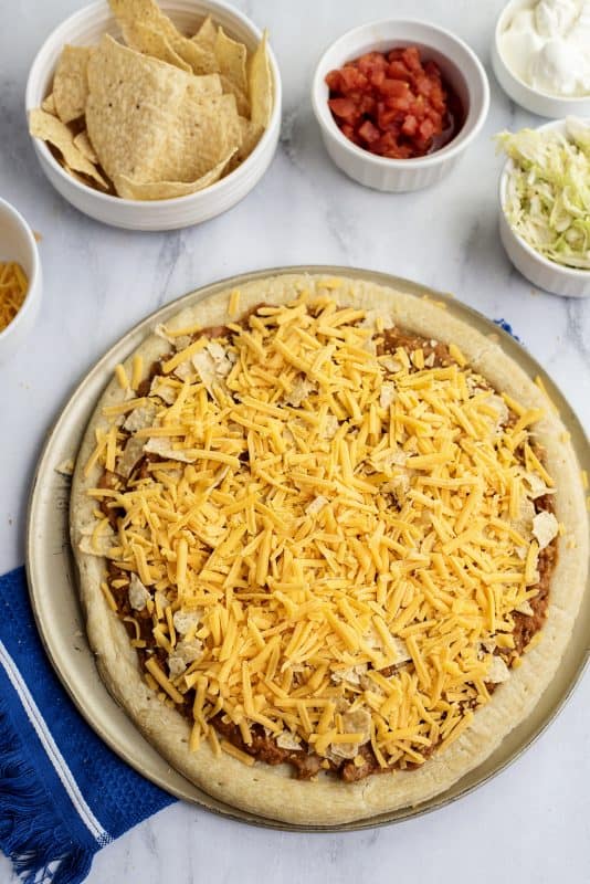 Top with shredded cheese.