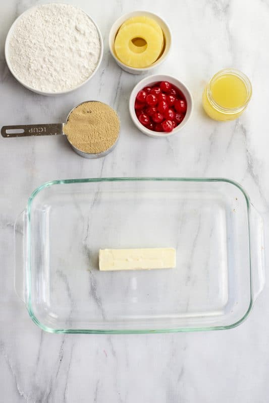 Melt butter in baking dish in preheating oven.