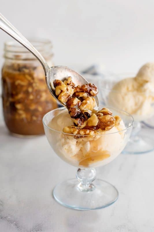 Walnuts on a scoop of ice cream.
