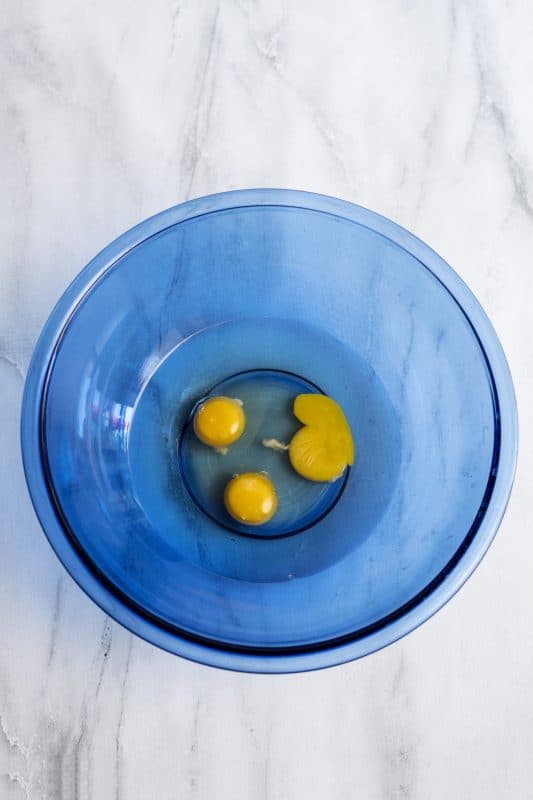 Place eggs and oil in a mixing bowl.