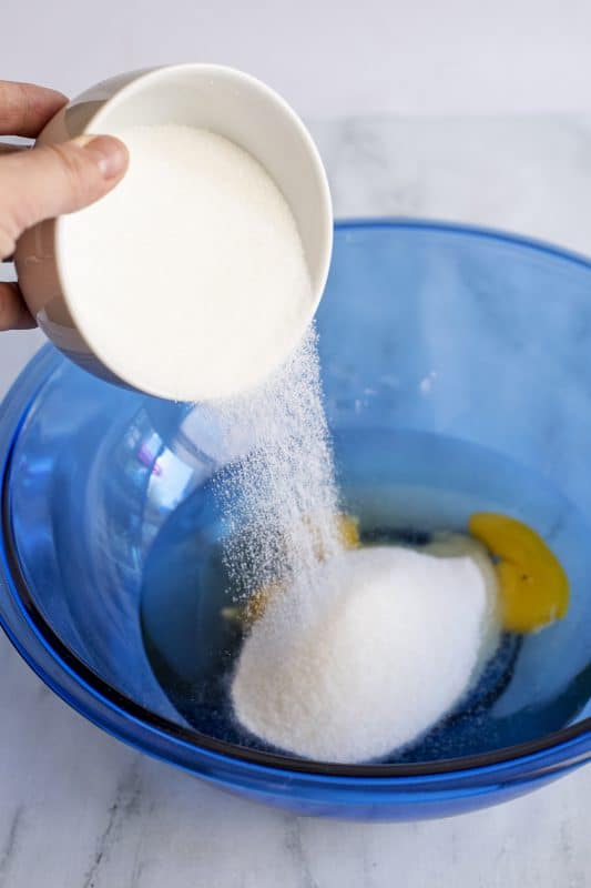 Add sugar to mixing bowl.