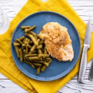 Plate of Ritz cracker chicken with green beans.