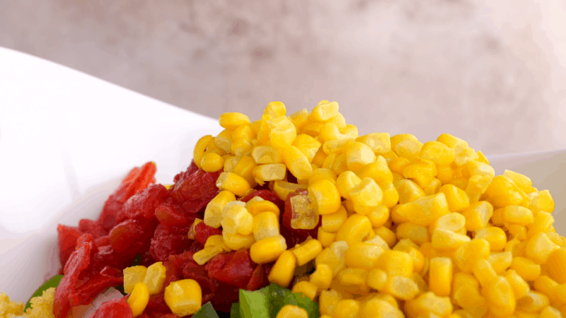 Veggies for cornbread salad in large bowl.