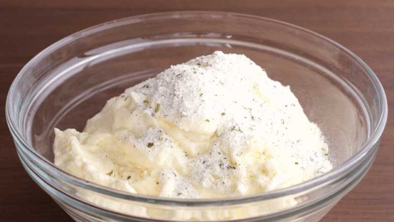 Ranch dressing mix and mayo in glass bowl.