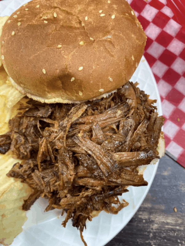 A shredded Barbecue beef sandwich cooked in a slow cooker featured at Meal Plan Monday 231