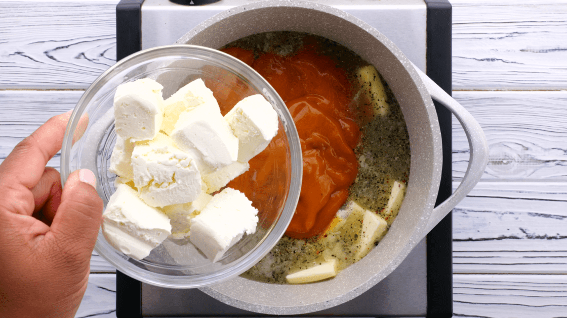 Add cream cheese to saucepot.
