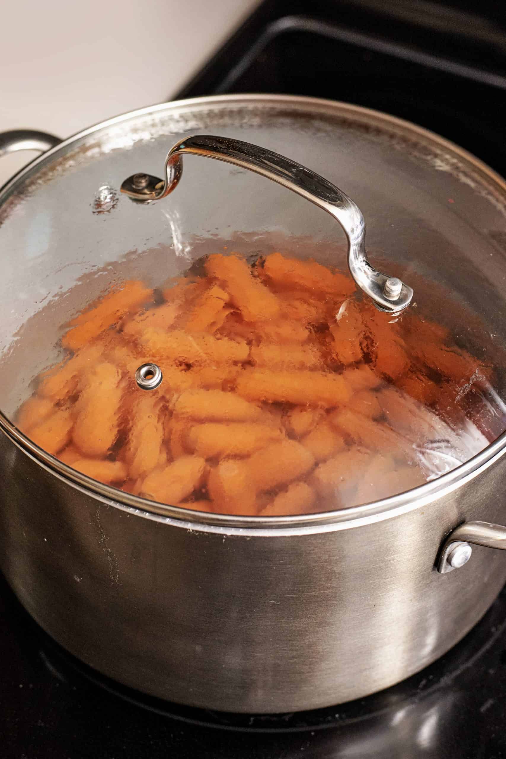 Place baby carrots in water