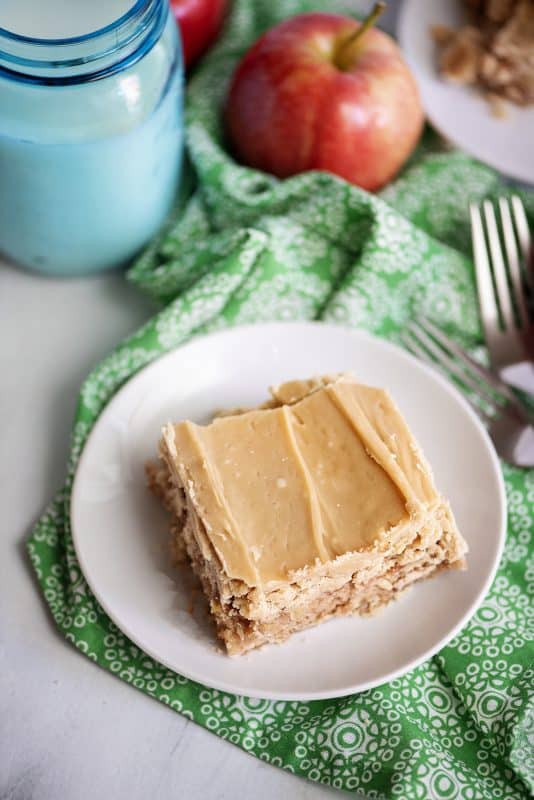 Slice of apple cake with caramel frosting.