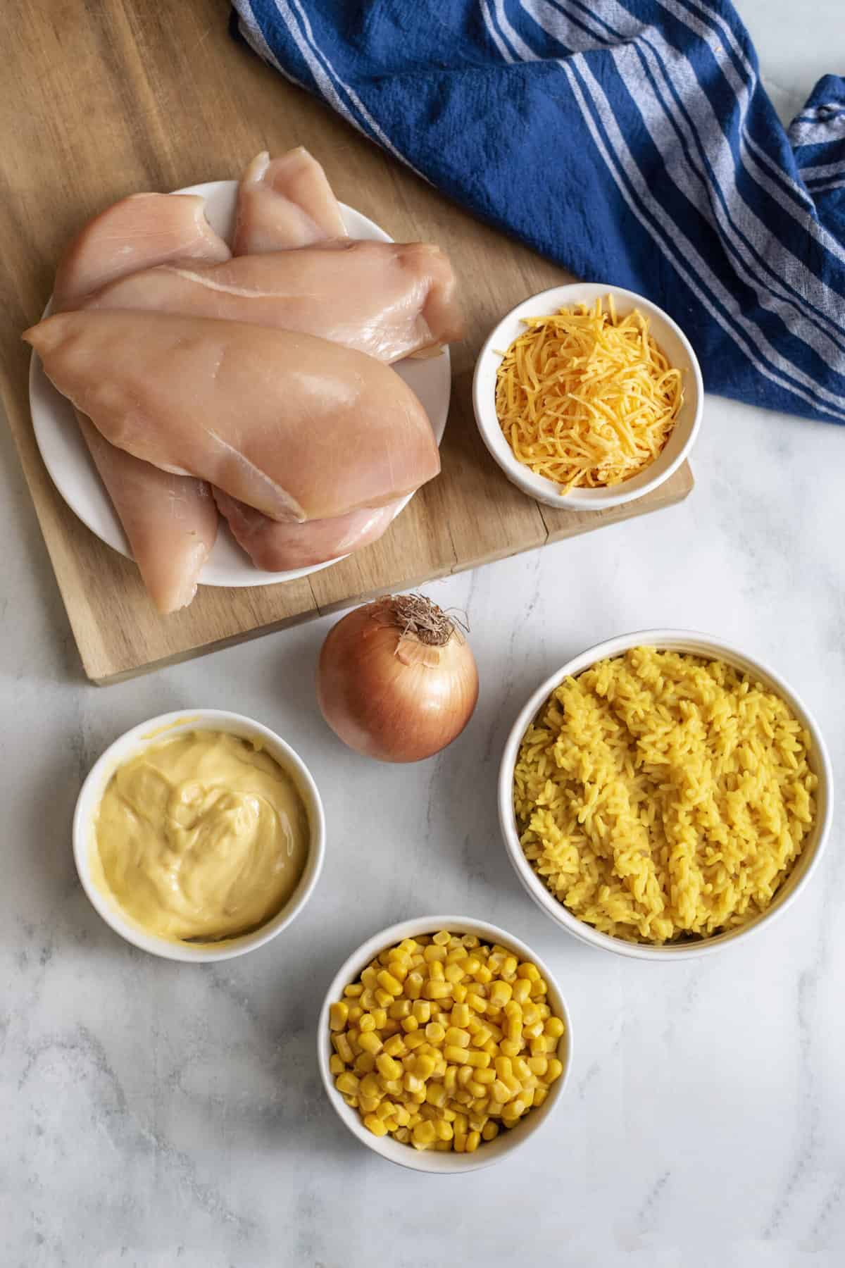 Ingredients for crockpot cheesy chicken and rice.