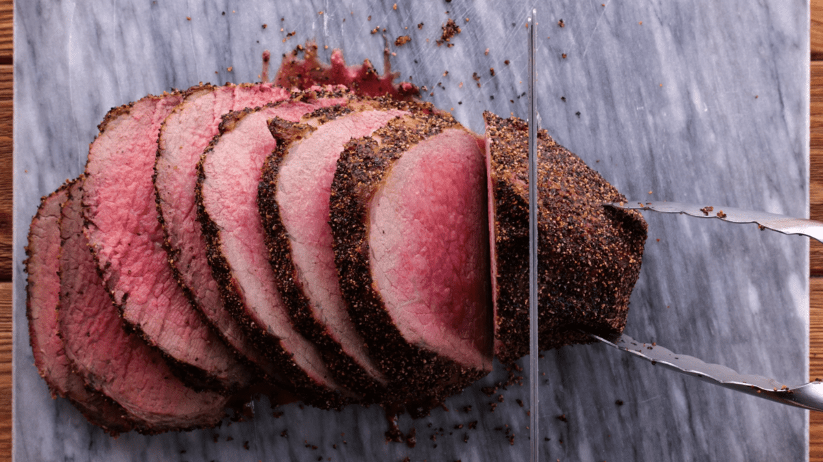 Slice eye of round roast with electric knife.