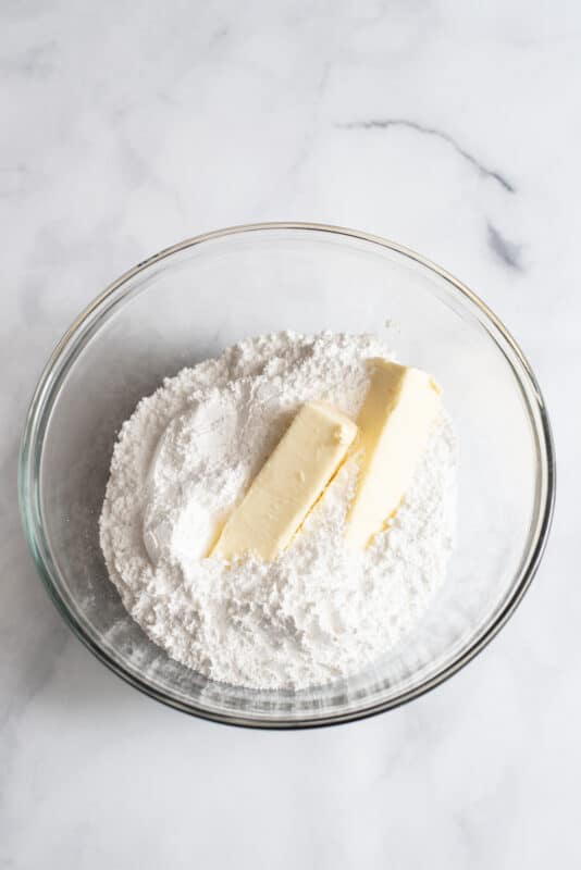 Butter and sugar in mixing bowl.