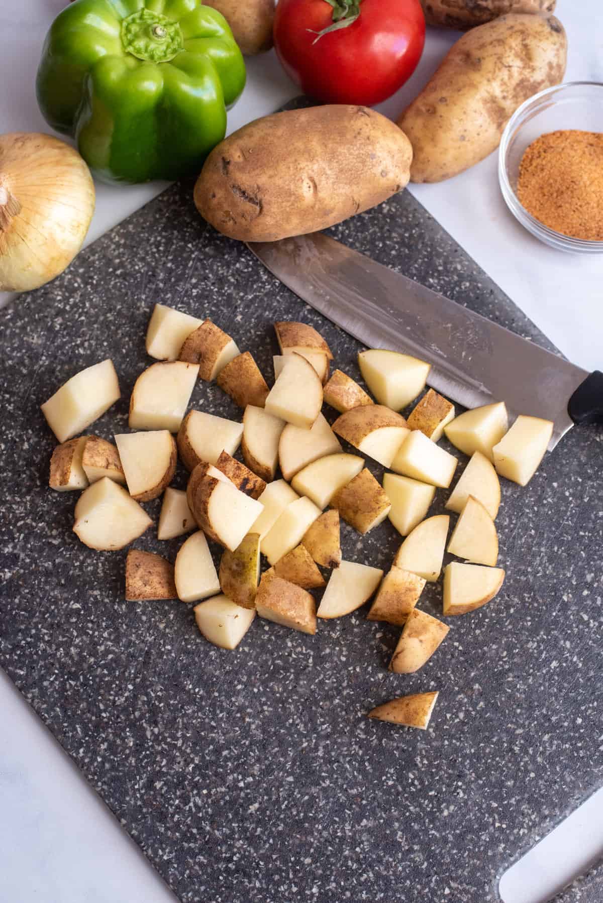 Wash and chop potatoes.