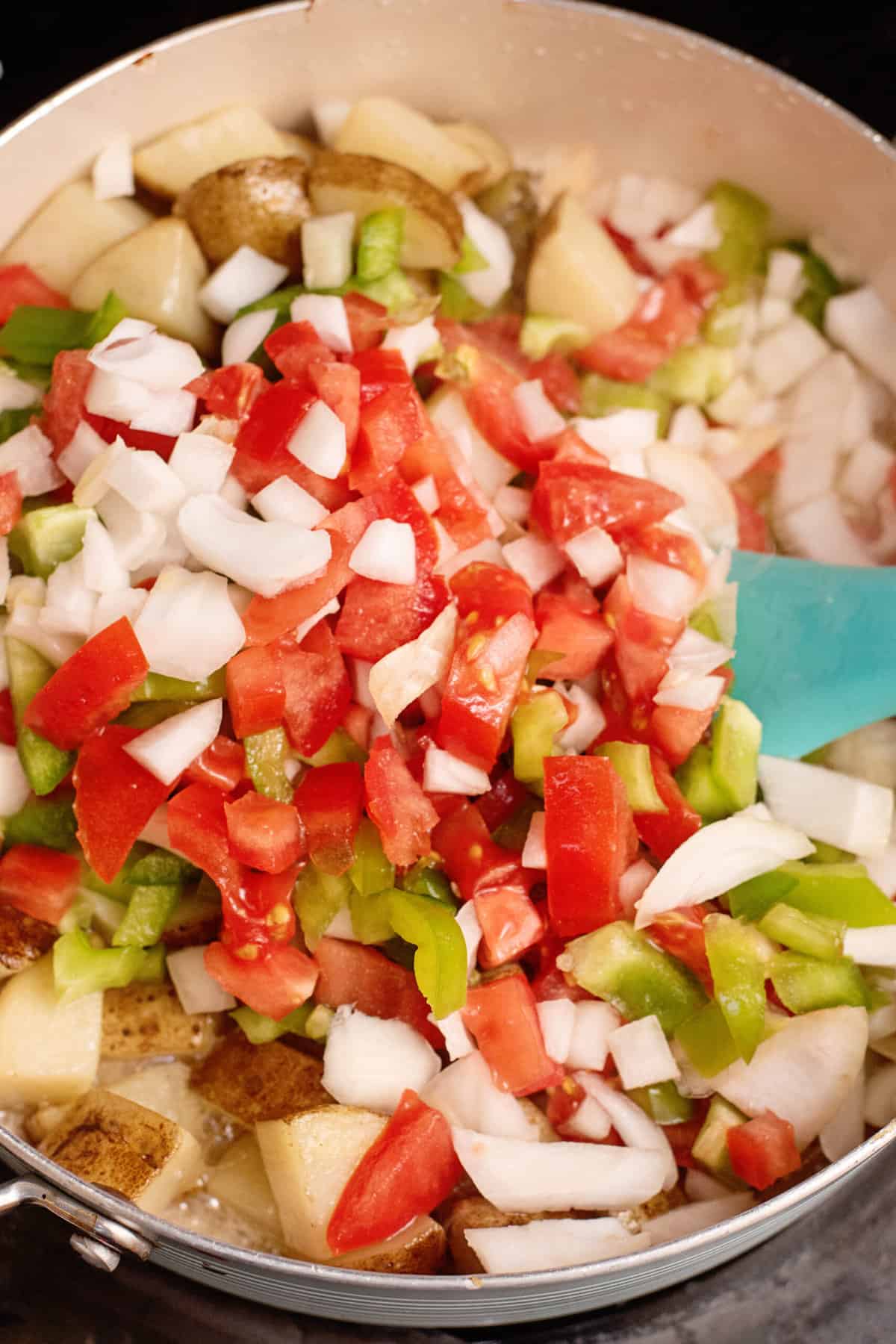 Add chopped veggies to skillet.