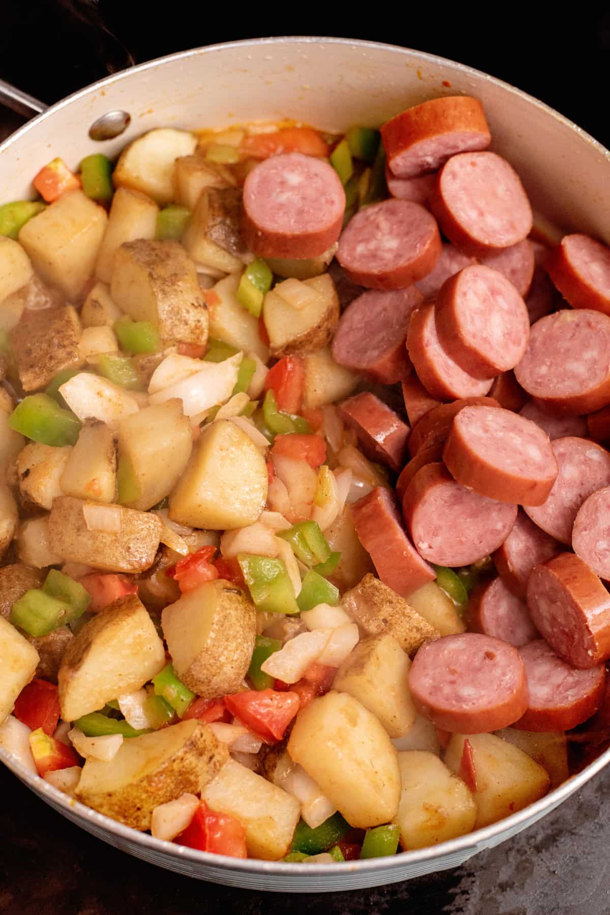 Once potatoes are slightly tender, add kielbasa.