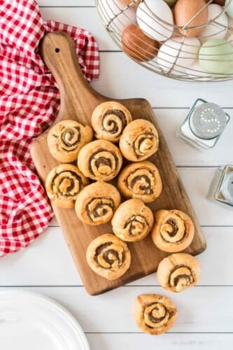 Sausage pinwheels on wooden board..