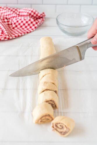 Cut dough into even slices with knife.