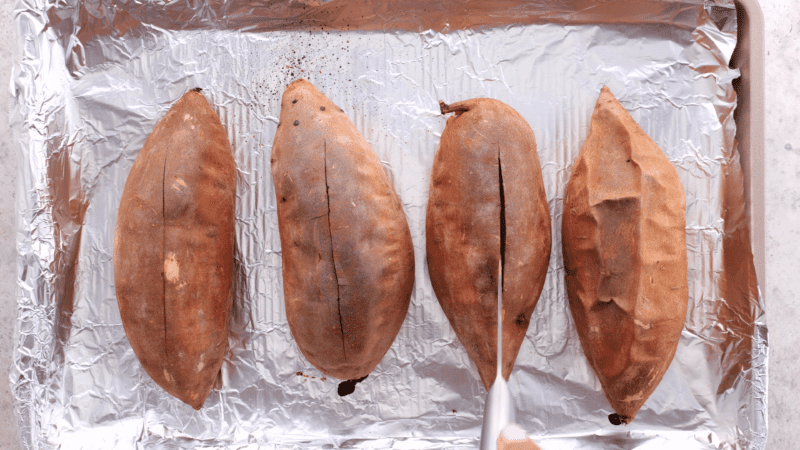 Slice sweet potatoes down middle.