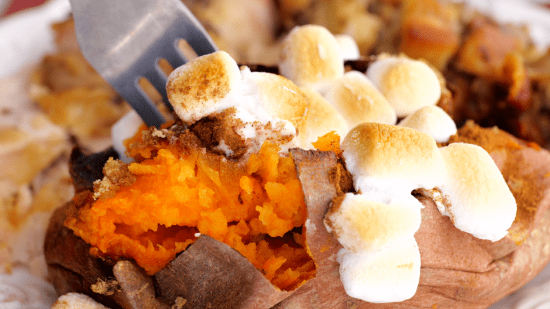 Forkful of baked sweet potato.