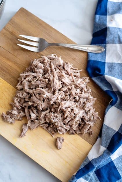 Shred the pulled pork using forks.