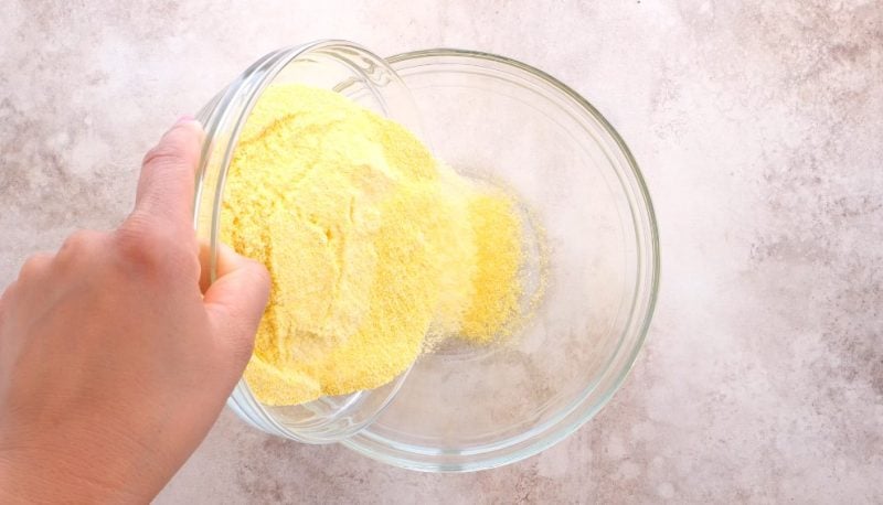 add self rising cornmeal to a medium size mixing bowl