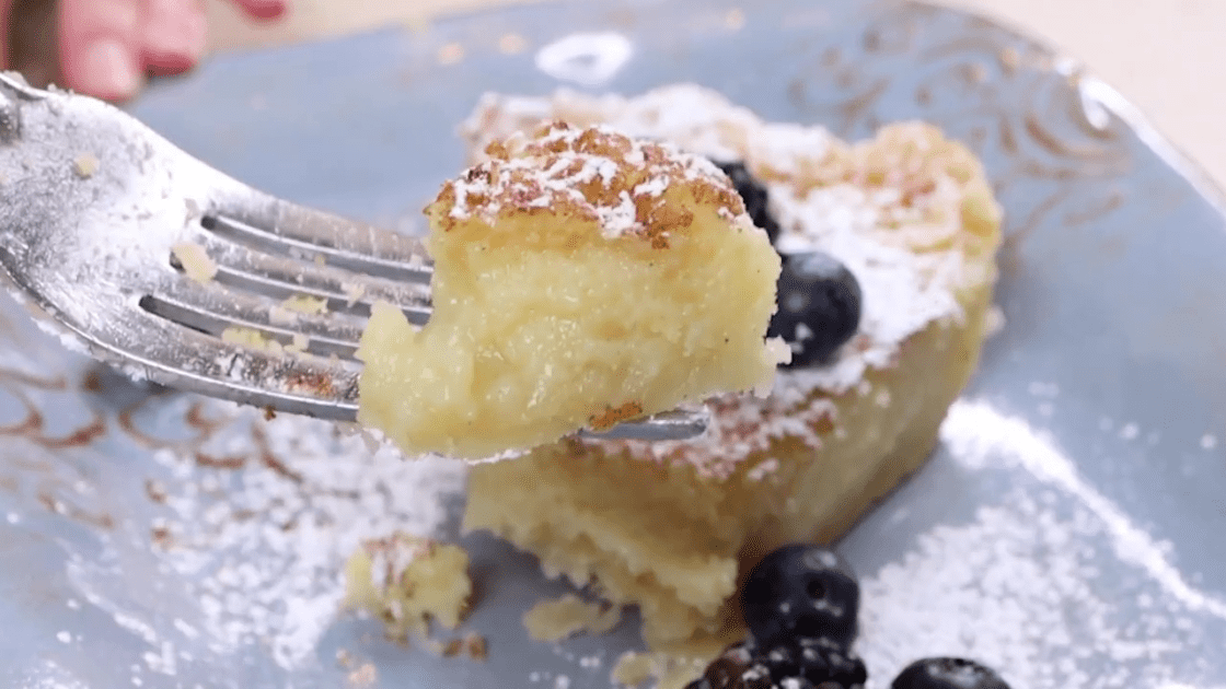 Bite of buttermilk chess pie on fork.