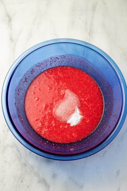 Add baking soda and vinegar to mixing bowl and combine.