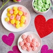 Multiple bowls of colorful cream cheese mints.