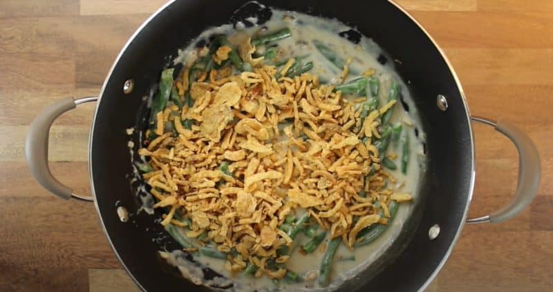 Add fried onions to green bean casserole sauce.