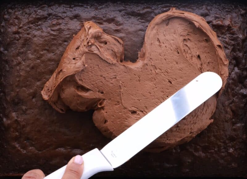 frosting the chocolate cake