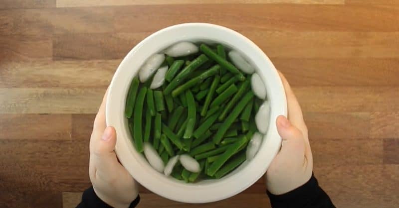 Green beans in ice-water bath.